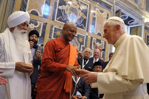 In this Friday, Oct. 28, 2011file photo provided by the Vatican newspaper Osservatore Romano, Pope Benedict XVI receives a delegation of religious leaders from all over the world he met at a peace meeting in Assisi yesterday, at the Vatican.