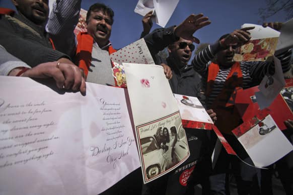 A small group of Hindu nationalist Ram Sena activists burn greeting cards during a protest against Valentine`s Day celebrations in Jammu.