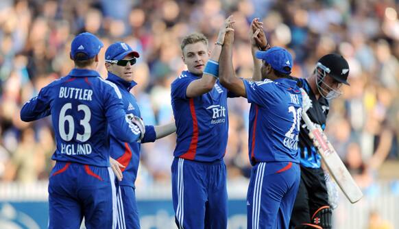 England`s Luke Wright, celebrates the wicket after dismissing New Zealand`s Hamish Rutherford for 40 caught behind by Jos Buttler in the Twenty 20 cricket match at Seddon Park, Hamilton, New Zealand.