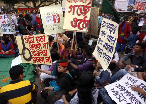 Bangladeshi activists hold placards as they protest to demand the death penalty for Jamaat-e-Islami leader Abdul Quader Mollah in Dhaka.