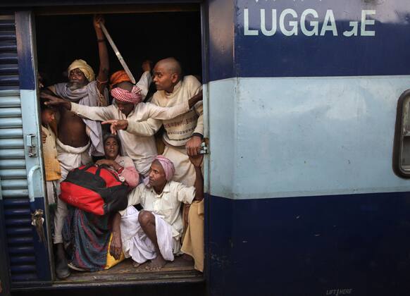Hindu devotee returning from Maha Kumbh festival travel in an luggage van of a train from the main railway station of Allahabad.