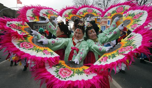 Korean women perform during the traditional Rose Monday carnival parade in Duesseldorf, Germany.