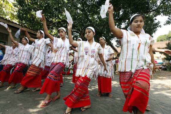 Clad in Karen traditional costumes, members of National Unity party perform traditional Done-Yain dance during a ceremony to mark the Union Day at the party`s headquarters, in Yangon, Myanmar.