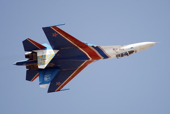 Russian air force air demonstration team, Russian Knights` Sukhoi Su-27 displays an inverted flight during the last day of the Aero India 2013 at Yelahanka air base in Bangalore.