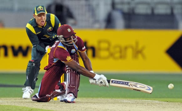 Australia`s Brad Haddin, watches West Indies` Johnson Charles hit a shot during their One Day International cricket match in Melbourne.