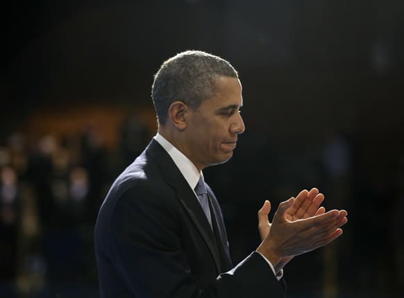 President Barack Obama applauds after introducing outgoing Defense Secretary Leon Panetta during a Farewell Tribute for Panetta, at Joint Base Myer-Henderson Hall in Arlington, Va.