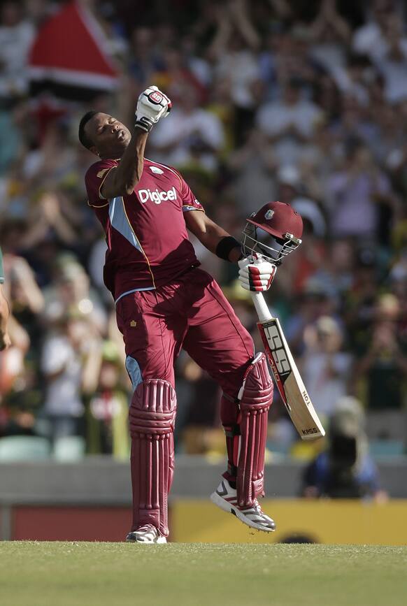 West Indies batsman Kieron Pollard reacts to hitting a century during their One Day International Cricket match against Australia in Sydney.