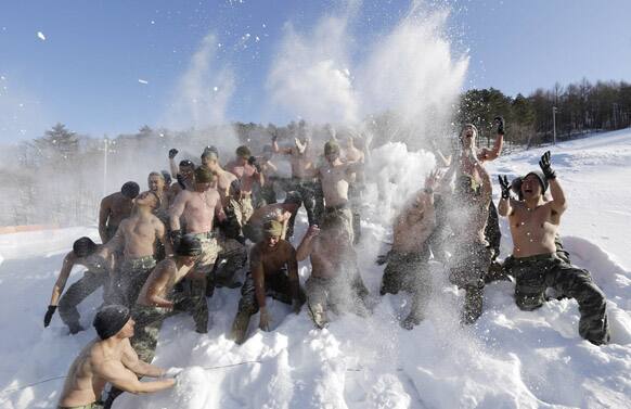 South Korean Marines and US counterparts from 3-Marine Expeditionary Force 1st Battalion from Kaneho Bay, Hawaii, throw snow to one another during their joint military winter exercise in Pyeongchang, east of Seoul, South Korea.