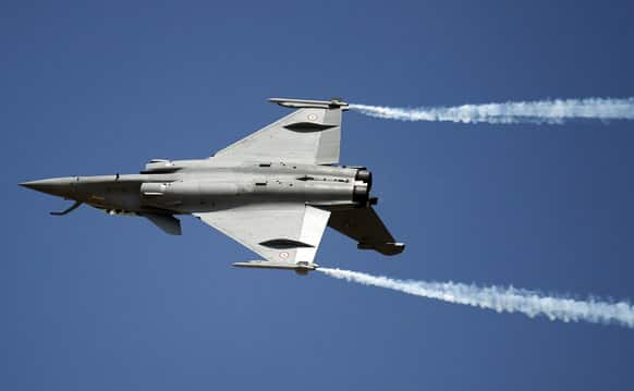 A French twin-engine Rafale fighter aircraft performs on the opening of the Aero India 2013 at Yelahanka air base in Bangalore.