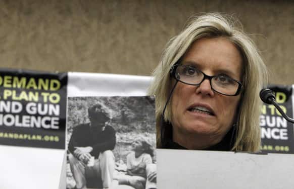 Kerry Kennedy, daughter of Robert F. Kennedy, speaks near a photo of her and her father during a news conference on Capitol Hill in Washington, to call on Congress to act on President Obama`s plan to reduce gun violence.