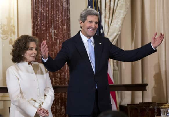 Secretary of State John Kerry, with his wife Teresa Heinz Kerry, reacts to the speech of Vice President Joe Biden during his ceremonial swearing-in as the 68th secretary of state, at the State Department in Washington.