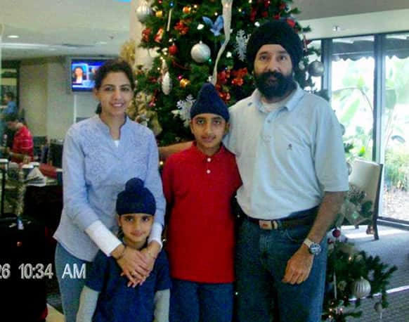 This 2011 photo provided Tuesday, Feb. 5 2013, by the Grover Family, shows Shivinder Singh Grover, right, wife Damanjit Kaur Grover, left, and their children. Shivinder Singh Grover killed his wife and two children before hanging himself in the apartment his family shared, police said Tuesday.