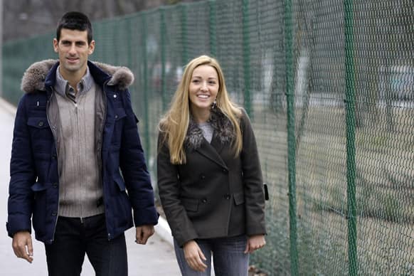 Serbia`s tennis player Novak Djokovic and his girlfriend Jelena Ristic arrive for a visit to a school for mentally challenged children in Belgrade, Serbia.