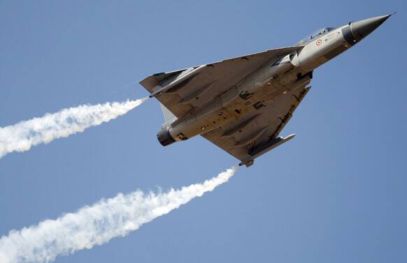 Tejas, an Indian Air Force light combat aircraft, performs during the opening of the Aero India 2013 at Yelahanka air base in Bangalore.