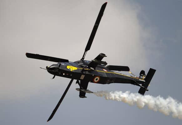 Rudra, India`s indigenous light combat helicopter performs during the opening of the Aero India 2013 at Yelahanka air base in Bangalore.