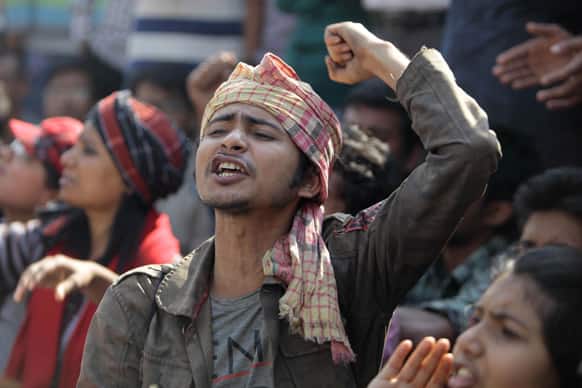 A man shouts slogans as government activists and other Bangladeshi people gather for a protest demanding death penalty for Jamaat-e-Islami leader Abdul Quader Mollah in Dhaka, Bangladesh.