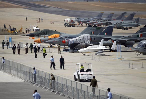 Fighter aircrafts and others are lined up at the tarmac during rehearsals on the eve of the Aero India 2013 at Yelahanka air base in Bangalore.