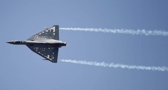 Indian Air Force single engine, tailless fighter aircraft Tejas performs during rehearsals on the eve of the Aero India 2013 at Yelahanka air base in Bangalore.