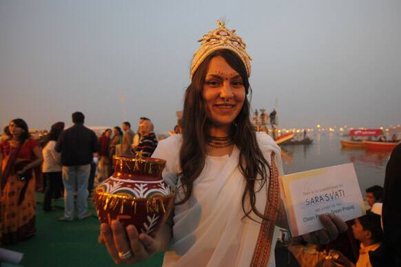 A foreign tourist campaigns for a clean Prayag, another name for Allahabad at the confluence of rivers Ganges, Yamuna during the Mahakumbh festival in Allahabad.