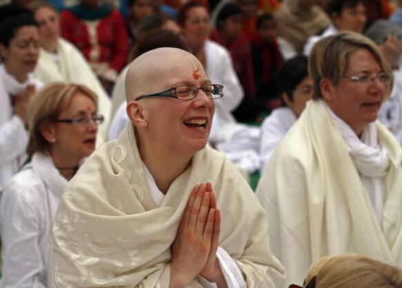 Kistel De Cat, 37, of Quebec, Canada, a devotee of Hindu holy woman Sai Maa, worships her during a consecration ceremony at Vishwayatan Satua Baba’s camp at Sangam, the confluence of rivers Ganges, Yamuna and mythical Saraswati, as part of the Maha Kumbh festival in Allahabad.
