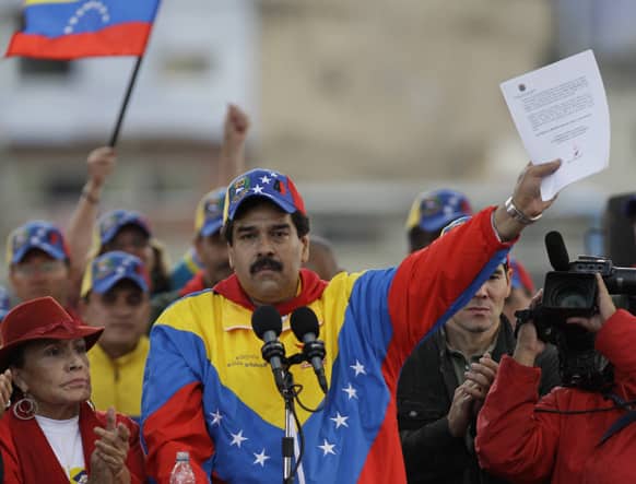Venezuela`s Vice President Nicolas Maduro holds up a letter that he said it was sent by Venezuela`s President Hugo Chavez to his supporters during a demonstration commemorating the anniversary of a failed coup attempt led by Chavez in 1992, in Caracas, Venezuela.