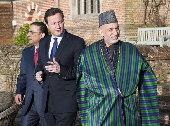 Britain`s Prime Minister David Cameron, centre, hosts a trilateral meeting with President Hamid Karzai of Afghanistan, right, and President Asif Ali Zardari of Pakistan, left, at his official country residence at Chequers, near Wendover, England.