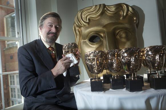 BAFTA Film host host Stephen Fry buffs and polishes the masks ahead of the award ceremony on Sunday , at the Bafta HQ in Piccadilly, central London.