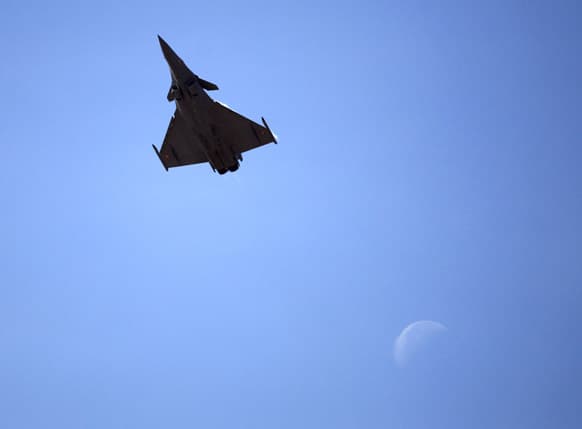 An Indian Air Force aircraft flies during rehearsals ahead of the Aero India 2013 in Yelahanka air base in Bangalor. Aviation companies from around the world are expected to participate in the five-day event that starts Feb. 6.