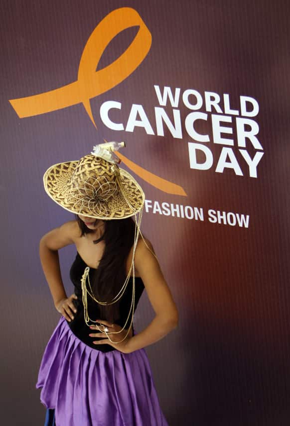 A woman participates in a fashion show on the occasion of World Cancer Day at the Apollo Cancer Hospital in Hyderabad.