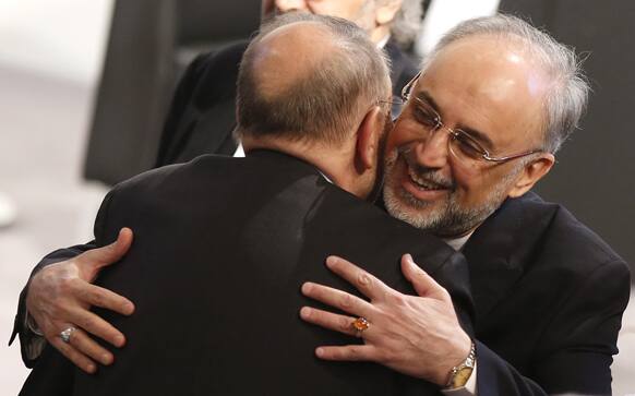 Iranian Foreign Minister Ali Akbar Salehi, right, hugs former NATO Secretary General Javier Solana as he arrives for the Security Conference in Munich, Germany.
