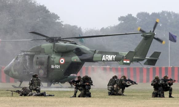Indian army commandos participate in a mock drill during a display of army equipment in Kolkata.