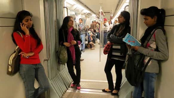 Women travel inside a Women Only metro train compartment in New Delhi. Five men pleaded not guilty after being formally indicted Saturday in a special court on 13 charges, including rape and murder, in the fatal gang rape of a woman in a New Delhi bus, a lawyer said.