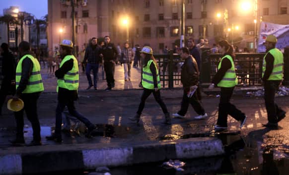 Egyptian volunteers of Tahrir Bodyguard, an anti-harassment group, work at a rally in Tahrir Square, Cairo, Egypt.