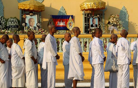 Buddhist monks wait in line at the Royal Palace to pay their respects to the late former Cambodian King Norodom Sihanouk in Phnom Penh.