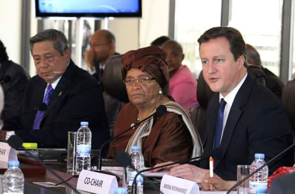 British Prime Minister David Cameron, right, Liberian President Ellen Johnson Sirleaf, center, and Indonesian President Susilo Bambang Yudhoyono co-chair a meeting of the United Nations High Level Panel in Monrovia, Liberia.