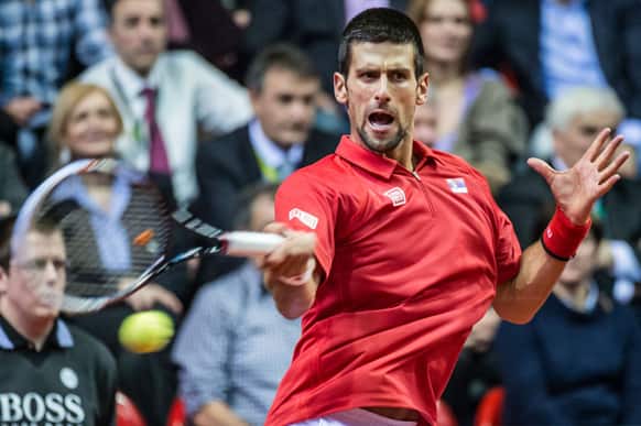 Serbia`s Novak Djokovic returns the ball during the Davis Cup World Group first round match against Belgium`s Olivier Rochus at the Spriroudome in Charleroi, Belgium.