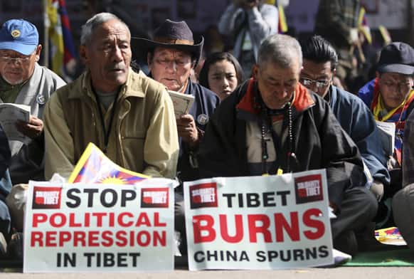 Exiled Tibetans pray in a rally during Tibetan People`s Solidarity Campaign in New Delhi. The four-day campaign that began Wednesday is held to express solidarity with Tibetans inside Tibet and to raise awareness and seek international support for Tibet.