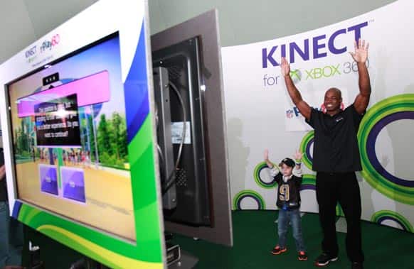 Young Duke Stein competes against NFL running back Adrian Peterson at Kinect for Xbox 360, in New Orleans.