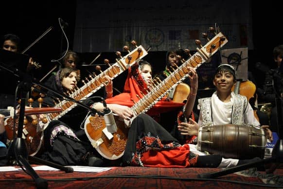 Afghan girl- students of Afghanistan National Institute of Music play sitars during a concert at the French cultural center in Kabul.