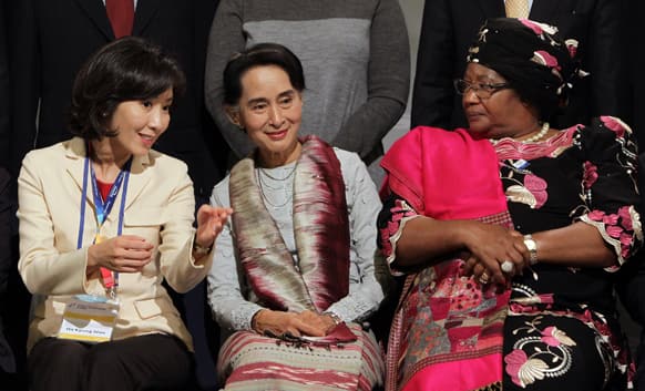 Myanmar opposition leader Aung San Suu Kyi talks with Na Kyung-won, chairwoman of the organizing committee for the 10th Special Olympics World Winter Games, and Malawi`s President Joyce Bandas, at the Global Development Summit during the 10th Special Olympics World Winter Games.