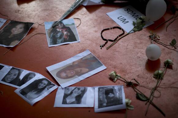A makeshift memorial that include pictures of the victims of the Kiss nightclub fatal fire is seen inside the gymnasium where a collective funeral was held a day earlier, in Santa Maria, Brazil.