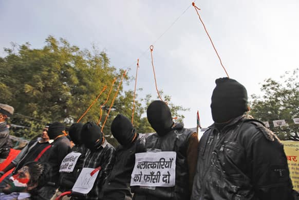 Six men enact a mock hanging during a protest demanding the death penalty for six men accused of the fatal gang rape of a young woman in New Delhi last month in New Delhi.