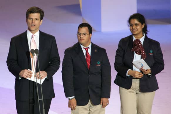 Timothy P. Shriver Ph.D. Chairman and CEO of the Special Olympics, left, gives his opening address with International Global Messengers Ariel Ary of Costa Rica and Neha Naik of India during the 2013 Special Olympics World Winter Games opening ceremony in PyeongChang, South Korea.
