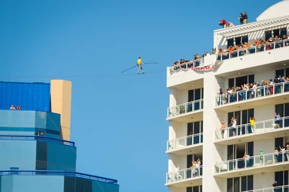 Aerialist Nick Wallenda walks the high wire 200 feet over U.S. 41 in Sarasota, Fla., without a safety harness.