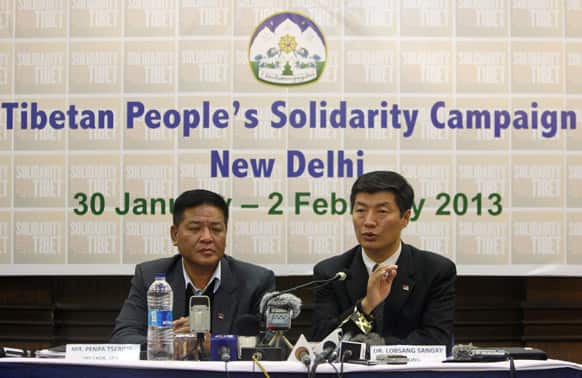 Prime Minister of the Tibetan government-in-exile Lobsang Sangay, right, speaks as Speaker Penpa Tsering listens during a press conference in New Delhi.