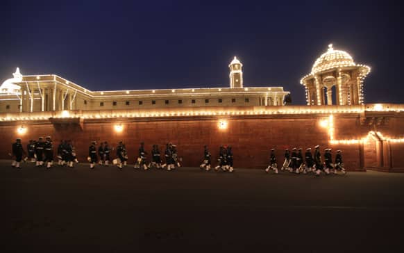 Members of Indian Naval band leave after full dress rehearsals of the Beating Retreat ceremony at Raisina hill which houses India`s most important ministries and presidential palace, in New Delhi.