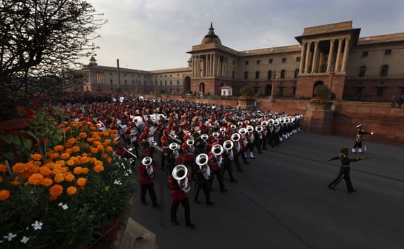 Military band from the three forces march to perform during full dress rehearsals of the Beating Retreat ceremony at Raisina hill which houses India`s most important ministries and presidential palace, in New Delhi.
