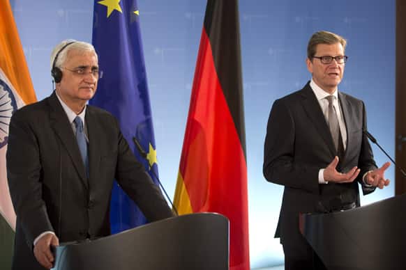 German Foreign Minister Guido Westerwelle, right, and his counterpart from India Salman Kurshid address the media during a joint press conference after a meeting at the Foreign Office in Berlin.