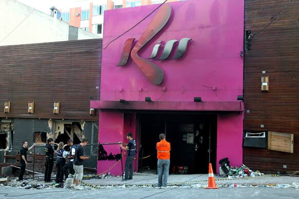 Police investigators inspect the entrance of the Kiss nightclub in Santa Maria city, Rio Grande do Sul state, Brazil.