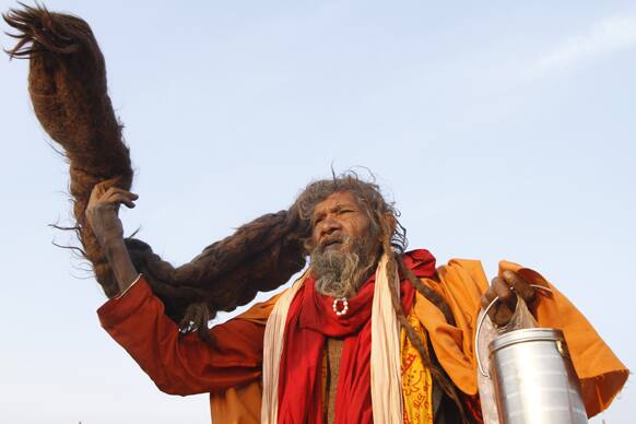 A Hindu holy man flaunts his hair at at